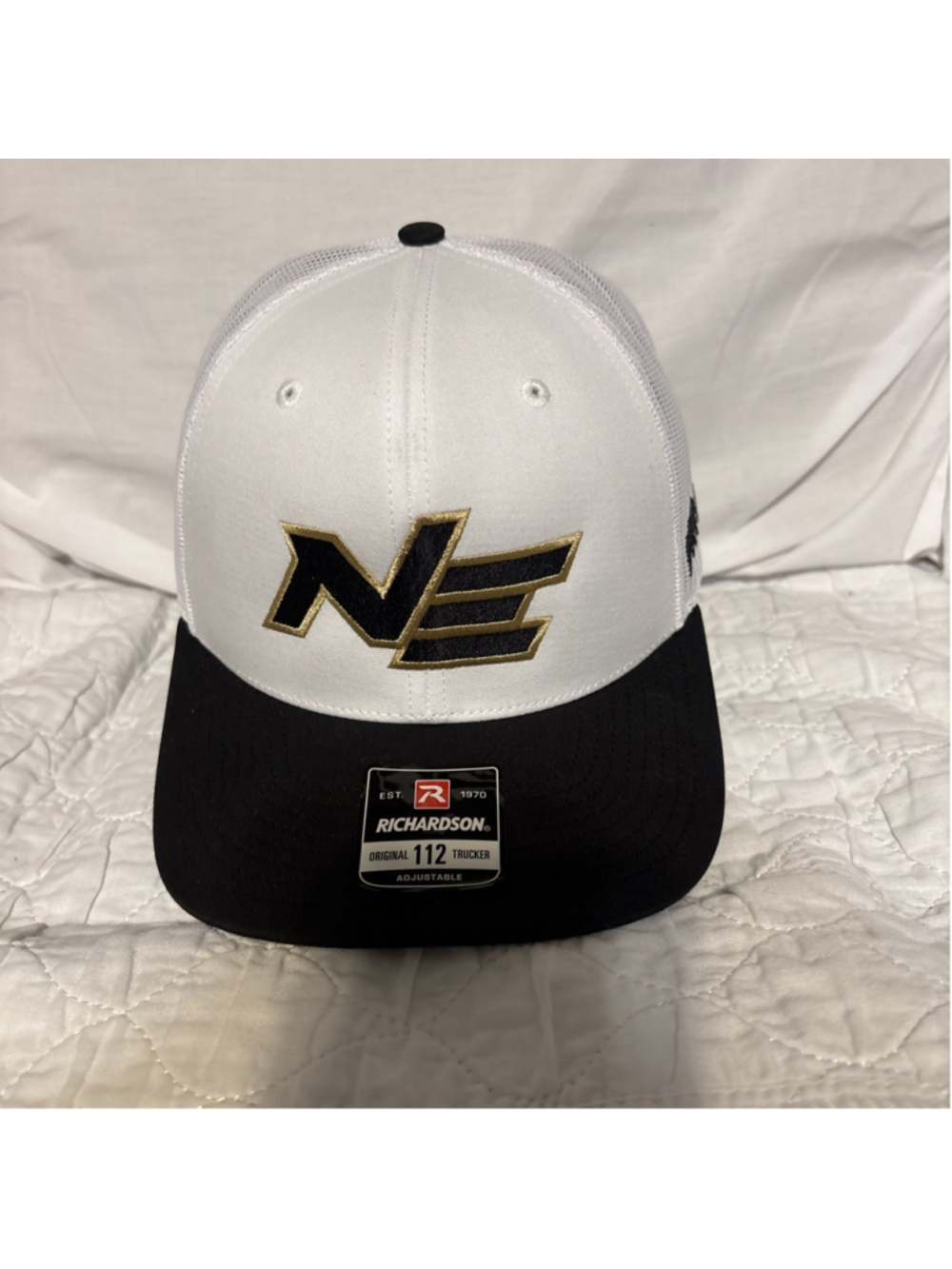 Richardson 112 Original Trucker Hat White Crown Black Rim Gold Logo “NE”